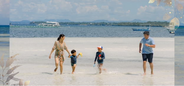 A family enjoying the beach after figuring out where to stay in Panglao, Bohol