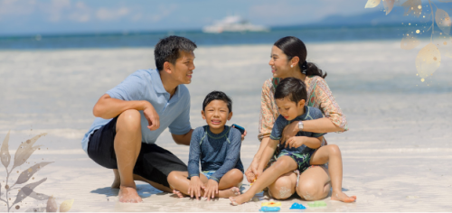 A family enjoying their summer trip on the beach near the best resort in Panglao, Bohol
