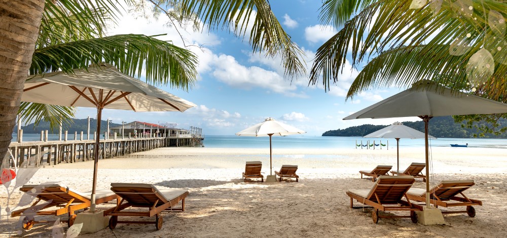 Modala beach chairs under umbrellas by the seashore in Panglao, Bohol